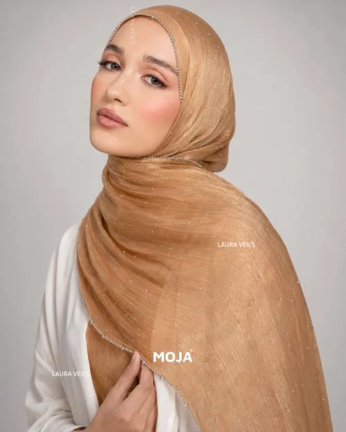 Woman wearing antique Moja organza shimmer hijab, silver chain lace border, draped instant style
