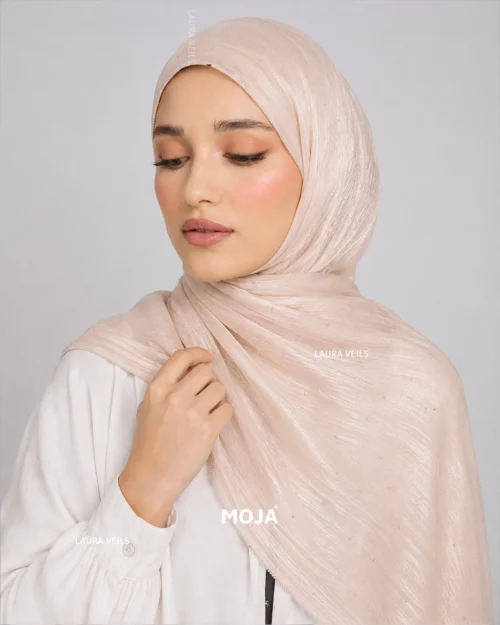 Woman wearing beige Moja organza shimmer hijab, silver chain lace border, draped instant style