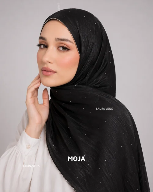 Woman wearing black Moja organza shimmer hijab, silver chain lace border, draped instant style