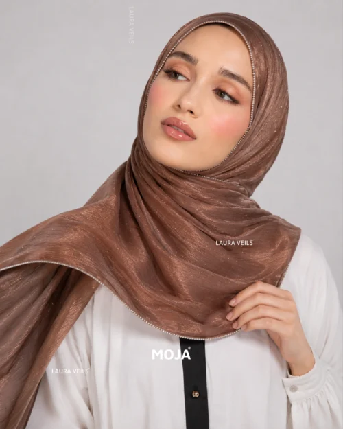 Woman wearing copper Moja organza shimmer hijab, silver chain lace border, draped instant style