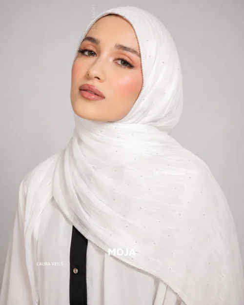 Woman wearing milk white Moja organza shimmer hijab, silver chain lace border, draped instant style