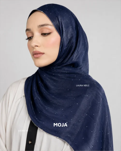 Woman wearing navy blue Moja organza shimmer hijab, silver chain lace border, draped instant style