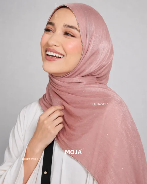 Woman wearing pink Moja organza shimmer hijab, silver chain lace border, draped instant style