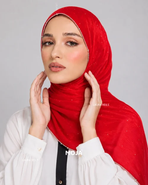 Woman wearing red Moja organza shimmer hijab, silver chain lace border, draped instant style